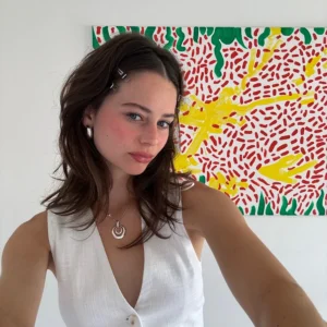 Fashion YouTuber Kate Brock posing in a stylish outfit